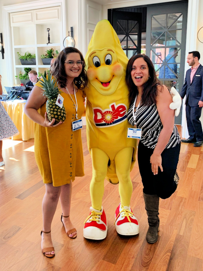 Bloggers Melanie from Clementine County and Caryn from Rockin' Mama pose with a Dole banana