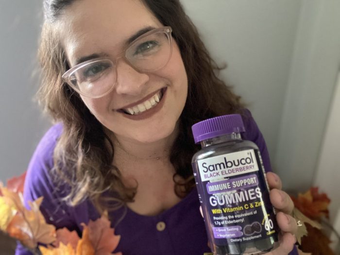 Woman Holding Sambucol Black Elderberry Gummies